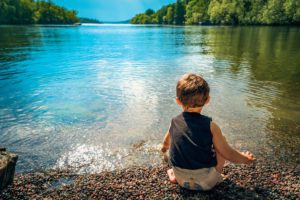 Child watching the lake
